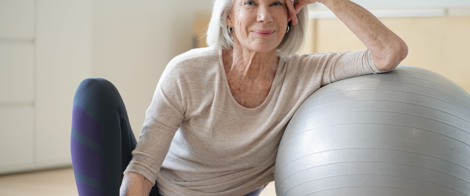 a picture of a woman with an exercise ball