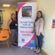 Joanne and Shaney stood either side of a cluster banner
