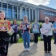 Image of people outside Morriston hospital holding different board games.