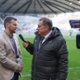 A man being interviewed on a football pitch