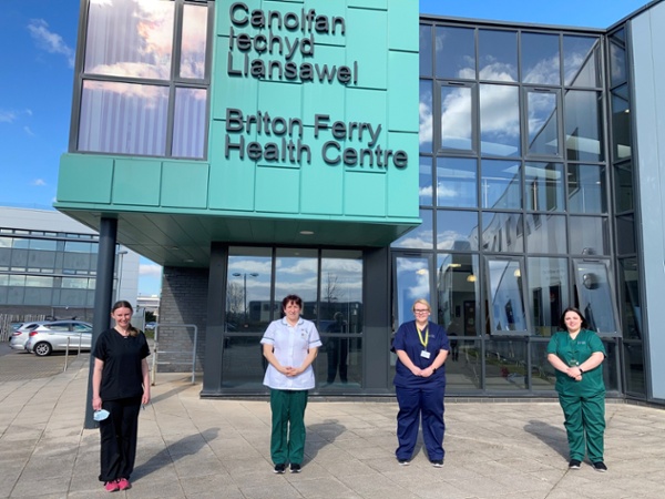 Members of the team stood outside the GP surgery