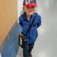 Young patient Jack Pawlowski walks out of Morriston Hospital with his mobile EEG in a small black cross-body bag