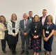 Health board and third sector staff stood in front of a screen