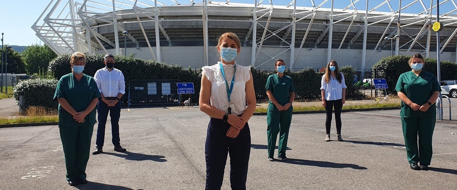 An image of the drive-through testing team at the Liberty Stadium in Swansea.