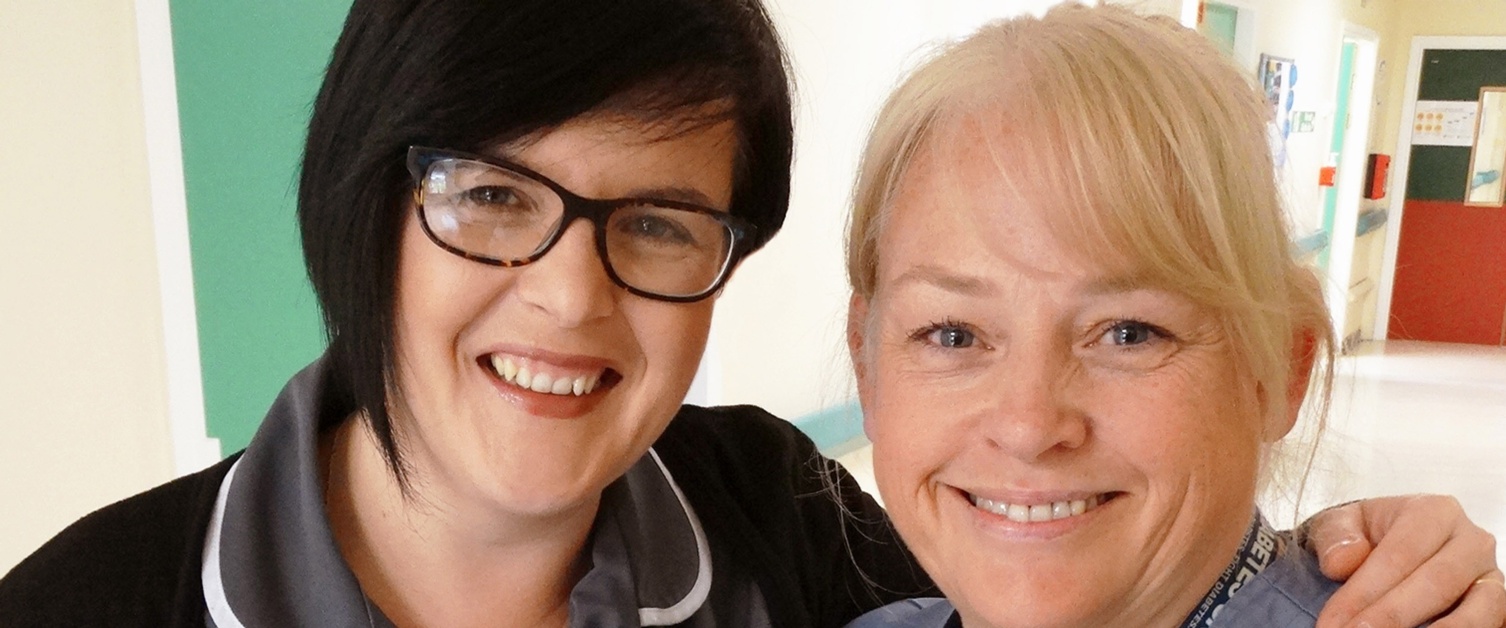 Two midwives smiling