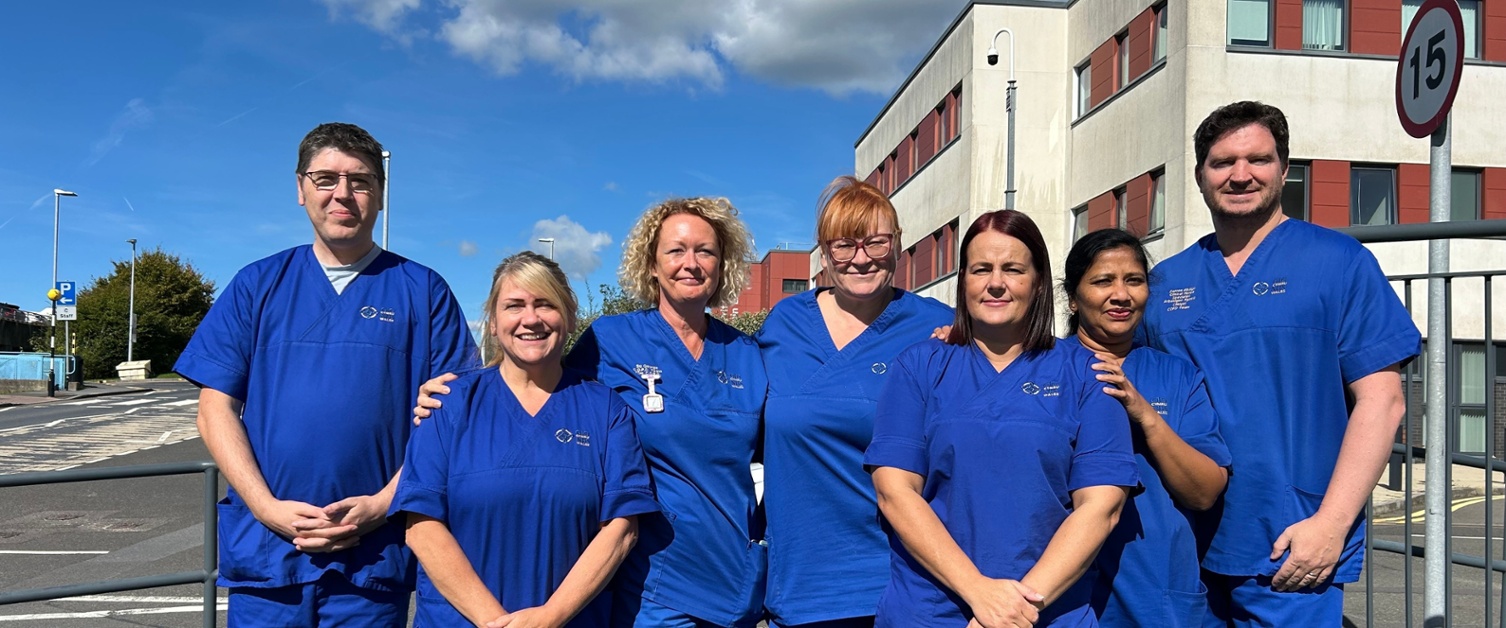 Members of the team stood outside the hospital