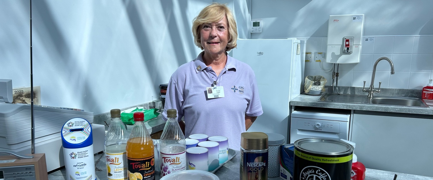 Teresa stood behind the tea bar