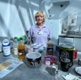 Teresa stood behind the tea bar
