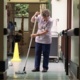 A woman mopping floors