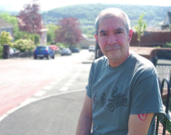 Image shows a man looking into the camera.