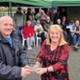 Clydach councillor Matthew Bailey hands the award to Belinda Gardiner