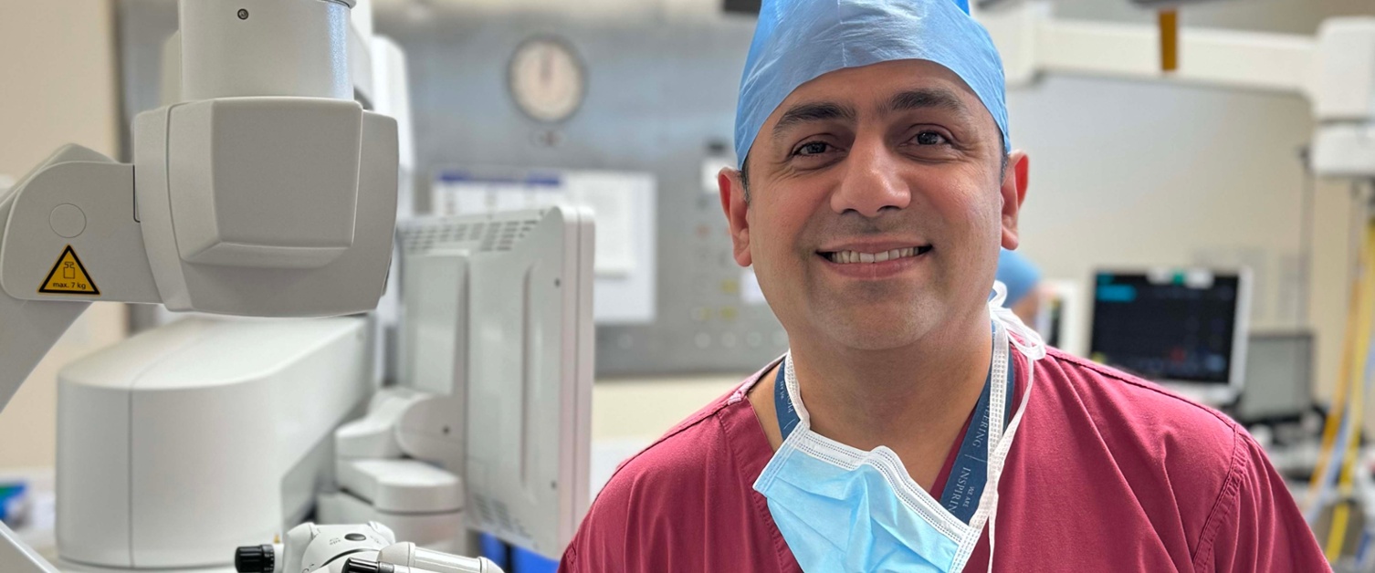 Image shows a surgeon in an operating theatre.