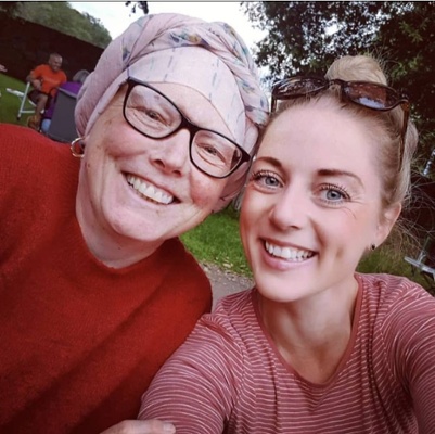 Catherine Davies and her sister Lisa, smiling for a family picture