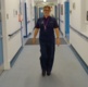 A Matron walking through a hospital corridor.