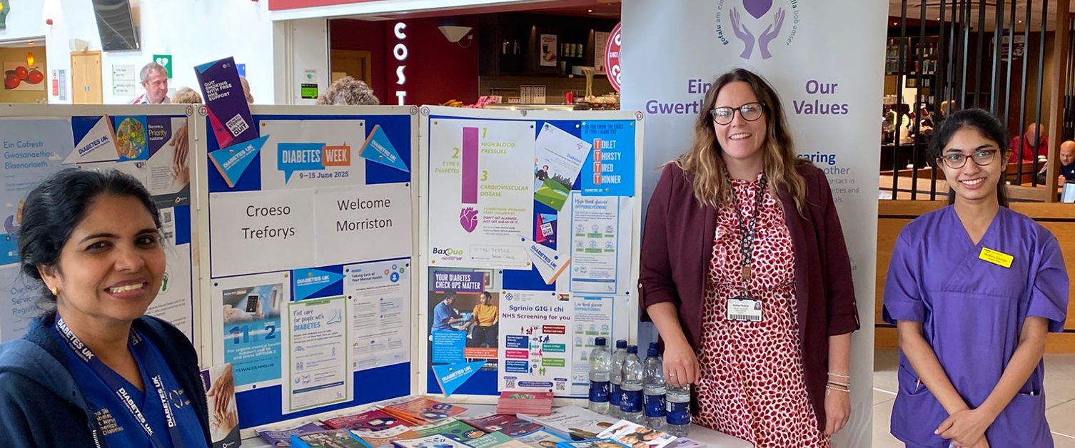 Team members stand by the information stall in Morriston Hospital.