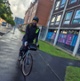 Image shows a man on a bicycle