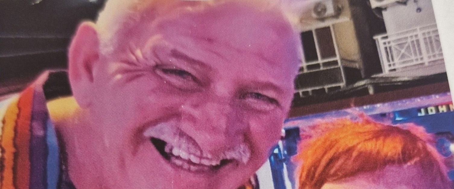 A photo of John with his wife