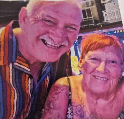 A photo of John with his wife