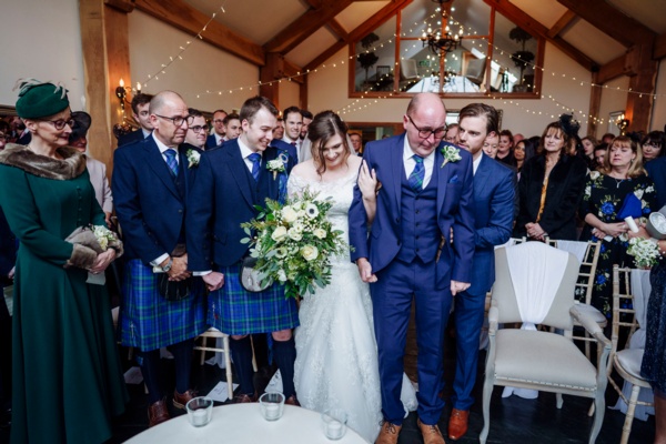 Bride walks down aisle