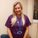 Image of Jessica Cartwright smiling and in purple scrubs.