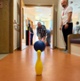 Image shows a man bowling a ball