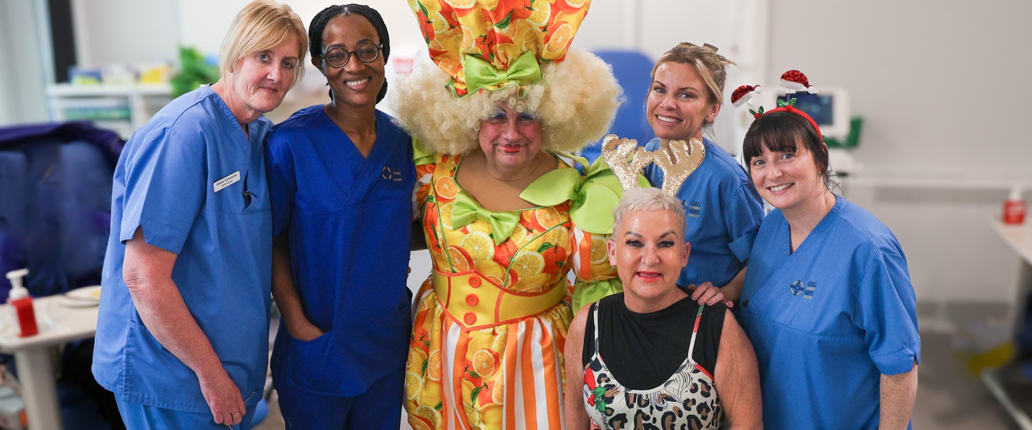 Kev in costume with staff from the Cancer Centre