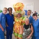 Kev in costume with staff from the Cancer Centre