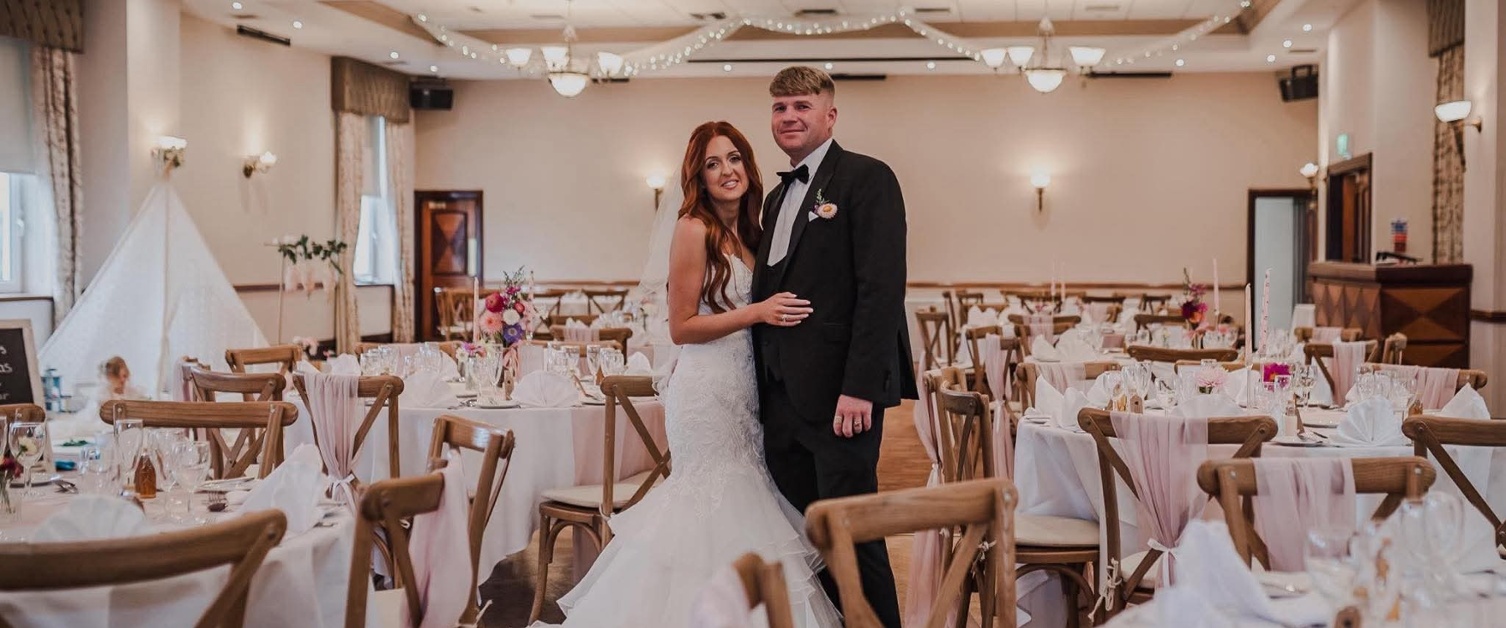Image shows a bride and groom on their wedding day
