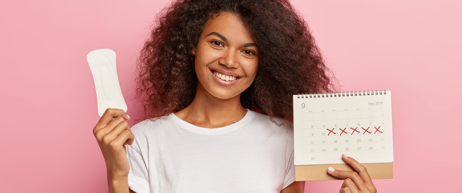A picture of a woman with a period pad