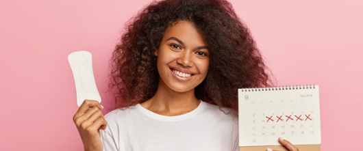 A picture of a woman with a period pad