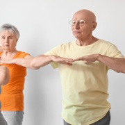 A picture of an older man exercising