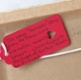 Image shows a handwritten note on a tag.