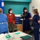 Eluned Morgan and Sue Tranka chatting with staff inside the hospital