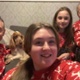 Image shows a family in Christmas clothing