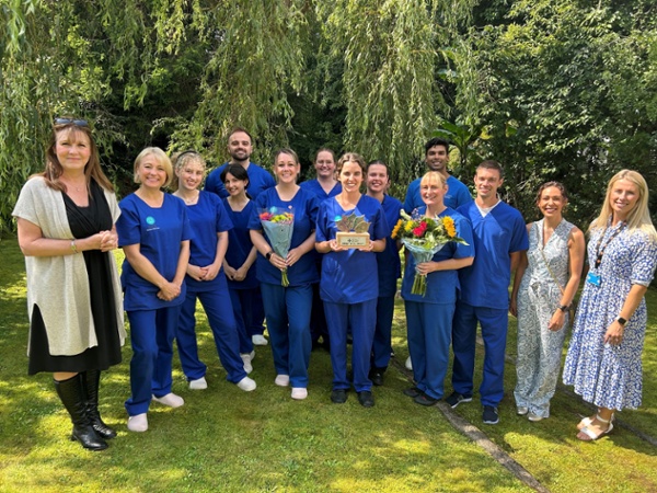 Dental staff with Public Health Wales staff in a garden area