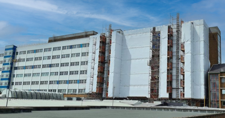 Image shows a building undergoing renovation