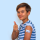 A young boy gives a thumbs up after receiving his vaccination.