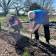 Image shows two men at a farm