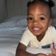Image shows a child smiling