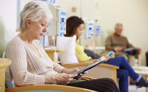Patients sitting in chairs and reading while having treatment