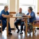 An image of patients talking to a nurse