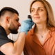 Image shows a person attending an audiology appointment