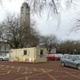 Image shows the Local Vaccination Centre with Guildhall in background.