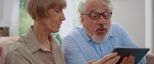 A picture of a couple with a phone