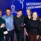 Image shows a group of people at an awards ceremony.