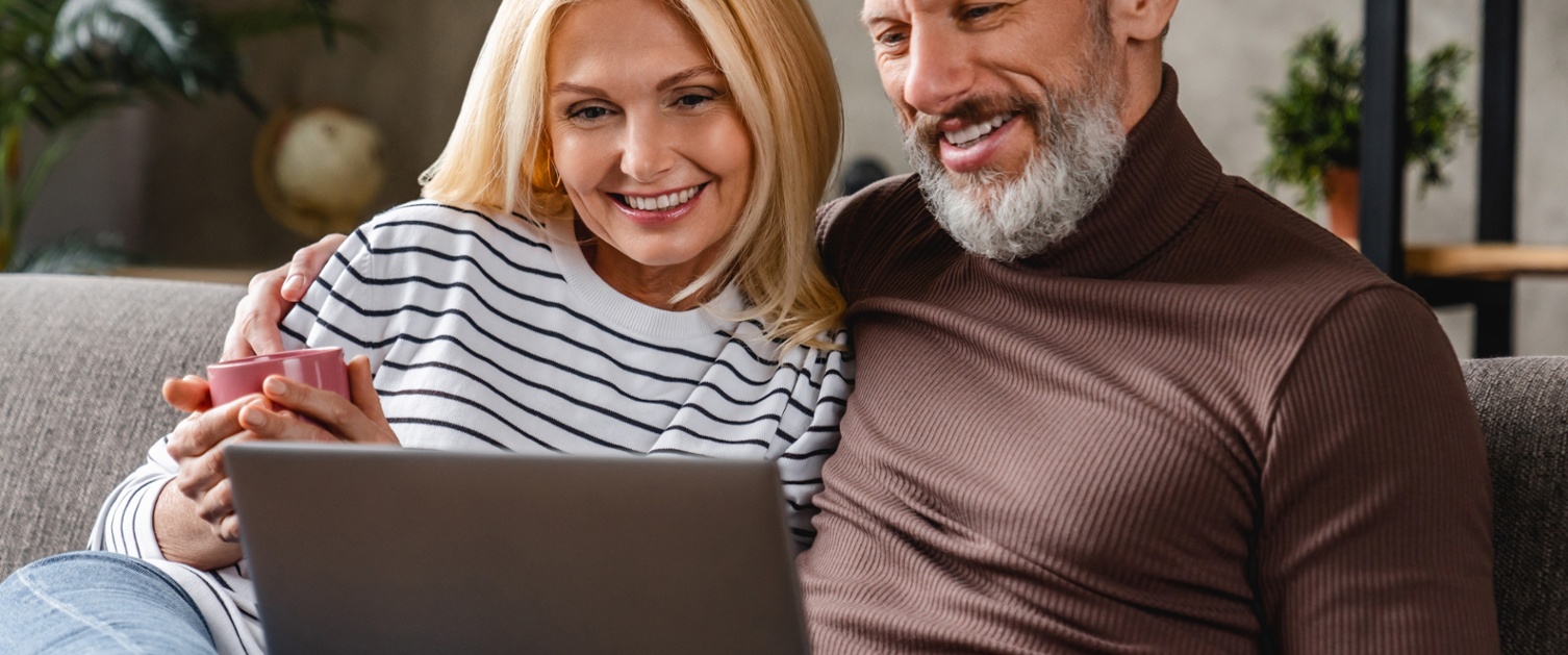 A couple looking at their laptop