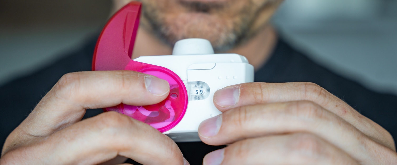 Going Green with your Inhalers Image shows a man holder an inhaler