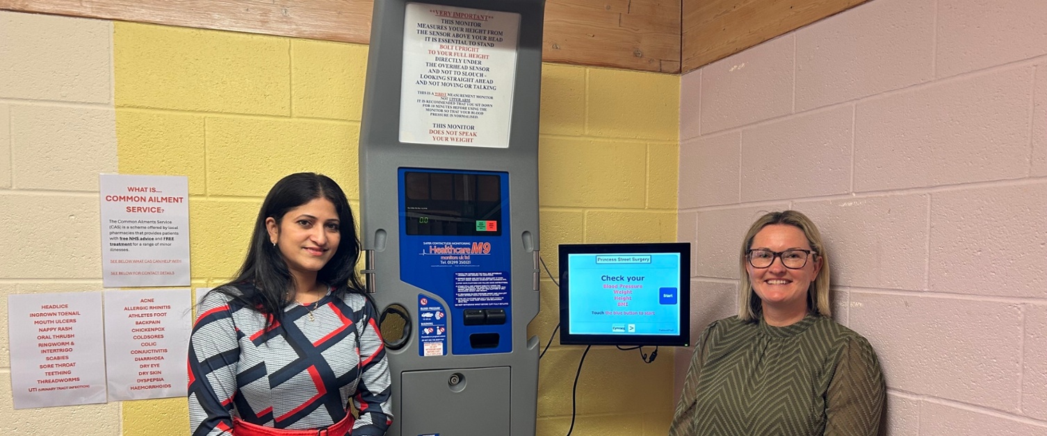 Sowndarya and Lorraine stood next to the machine