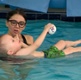 Image shows a mother and baby in a pool
