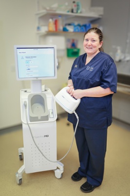 Louise holding a burns scanning machine